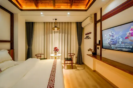 Qujing Xiaonanguo Hotel Отели в г. Цюйцзин