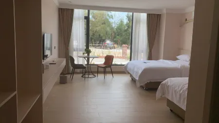 Shihua Zhuangyuan Homestay Отели рядом с достопримечательностью «Hailing Island National Wetland Park of Mangrove Forest»