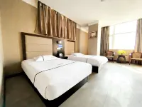 Yucheng Meigaomei Business Hotel (Yucheng New Bus Station)