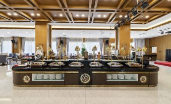 a large buffet table filled with a variety of food items , including meats , fruits , and desserts at xizang hotel  （Norbulingka shop)