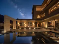 Shangheli · Golden Light Over Snowy Peaks Wild Luxury Mountain Resort Hotels near Lijiang Snow Mountain Falcon Valley Scenic Area