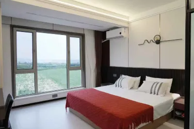 Tiantian Youxi Inn (Changshou Bay Tourism Resort Branch) Hotels near Longtou Temple