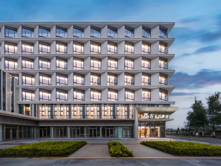 Magnolia Business Hotel (Jiaxing Nanhu Science and Technology City Branch) Отели рядом со станцией Jiaxing South Railway Station