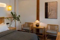 Windlnn.Boutique Garden Inn at Lijiang Old Town (South Gate) - ที่มีบาร์