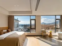 Beyond the Clouds · Golden Sunrise | Snow Mountain & Lake View Secret Garden Hote Hotels in Lijiang