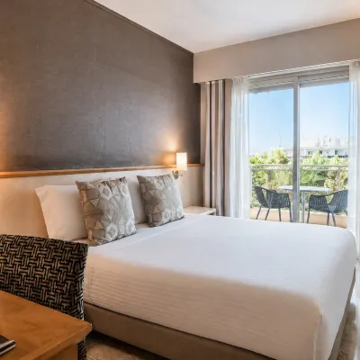 The Originals Boutique, Hôtel les Strélitzias Hotels near Le Fort Carre