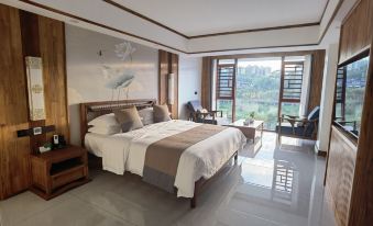Mengla Liangqi Yunshe Business Hotel