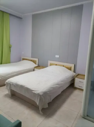 暖居民宿（南二環理工店） Hotel di China University of Geosciences Great Wall College