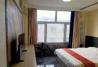 Arongqi Colorful Hotel Hôtels à : Bannière d'Arun