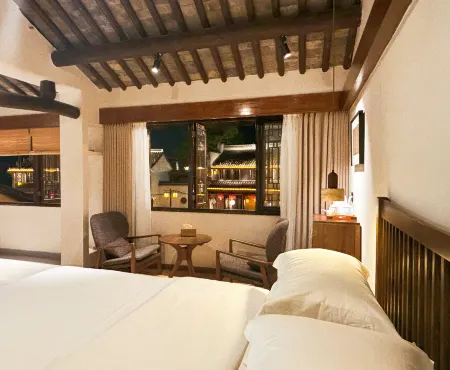 Nanxun Chunjigming Nongwatang Hotel Отели рядом с достопримечательностью «Zhejiang University of Water Conservancy Hydropower (Nanzhang Campus)»