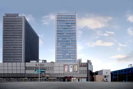 Wanda Spring Business Hotel (Daqing Sa'ertu Wanda Plaza) Отели рядом с достопримечательностью «Daqing Times Square»