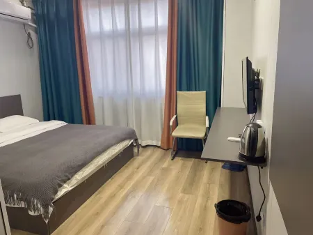 Gangnan Apartment Hotel Отели рядом с достопримечательностью «Yuncheng Finance and Economics School»