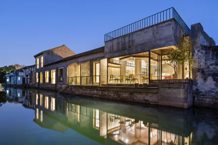 Muchen Heyin Garden Design Hotel (Shaoxing Lu Xun Hometown Cangqiao Zhijie Branch) Отели рядом с достопримечательностью «Cangqiao Street»