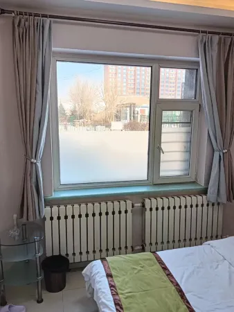 Harbin Nuanju Apartment Отели рядом с достопримечательностью «Heilongjiang Oriental College»