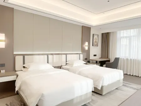 Kuche Hotel (Building C) Отели рядом с достопримечательностью «Qingchengqiang Site»