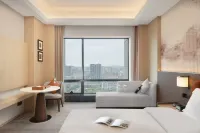 Wyndham Grand Hotel Loudi Отели рядом с достопримечательностью «Площадь города Вайцзян Яуйюань»
