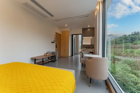 Enshi Xingtian Jiayuan Homestay (Yunlong Ground Fissure Store, Grand Canyon Scenic Area) Отели рядом с достопримечательностью «Yizhuxiang Column»