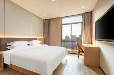 Hangzhou Nuomeihua Business Hotel (Shengtangyang Commercial Complex) Отели рядом с достопримечательностью «Цинхуань»