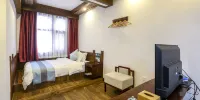 Yizhu Qingfeng Homestay (Zhangjiajie Wulingyuan Logo Gate Forest Park Branch) - Comfy Tatami Room