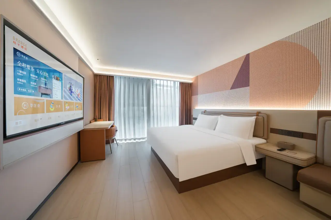 Deluxe Family Room with separate bedroom and living area at Orange Hotel Zhuhai