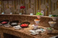 Ginkgo Qizhuang Hotel - servizio colazione
