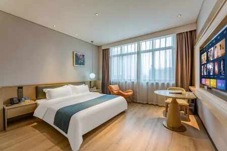 Long King Boutique Hotel (International Trade Centre) Отели в г. Мэнчэн
