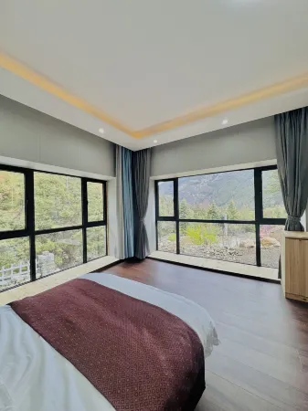 Mugui Kangba Homestay Отели рядом с достопримечательностью «Lotus Sea»