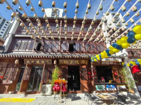 Jiaoxiang Manju Homestay (Longnan Wanxiang Street) Отели в г. Луннань