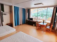 Xuegu Bilaolv Hostel Hotel - โรงแรมราคาถูก
