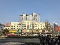 โรงแรมโฮมอินน์ รุ่ยบายยูน ยุน (สถานีรถไฟถนนซินเถียน ฮูมา) โรงแรมในฮูมา