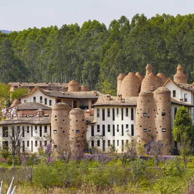 Dongfengyun Niuduoluo Music Castle Hotel Hotels near Yunnan Red Chateau