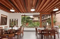 Puzhehei Riverside Inn - servizio colazione
