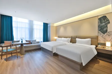 Manju Hotel (Changchun Yuanda Shopping Center) Отели рядом с достопримечательностью «Changchun Workers Gymnasium»