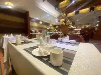 Iris Orchard All Suites Hotel (Tangshan Convention Center) - servizio colazione