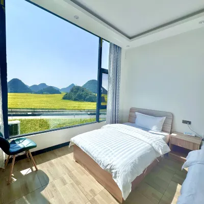 Luoping Chunri Xiaoyuan Homestay (Jinji Peak Cong Branch) โรงแรมใกล้จินจิลิง