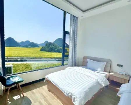 Luoping Chunri Xiaoyuan Homestay (Jinji Peak Cong Branch) فنادق في لوى بينغ