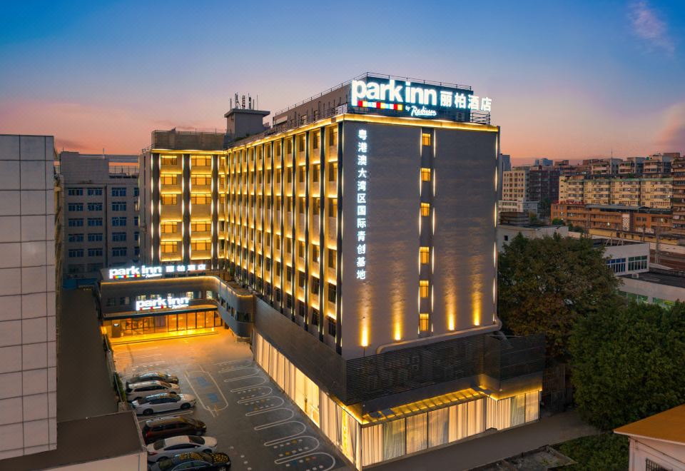 The rendering depicts a hotel illuminated at night, with a dark sky adorned with stars at Park Inn by Radisson Guangzhou Railway Station Yuexiu International Congress Center