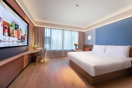 Orange Hotel (Xinyi South Railway Station Branch) Отели в г. Синьи