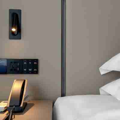 柏曼酒店(興業高鐵站商業街店) Rooms