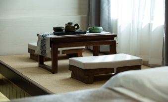 Yunjing Zhinan · New‑Chinese‑Aesthetics Designer Smart Inn (Big Water Wheel, Lijiang Ancient City)