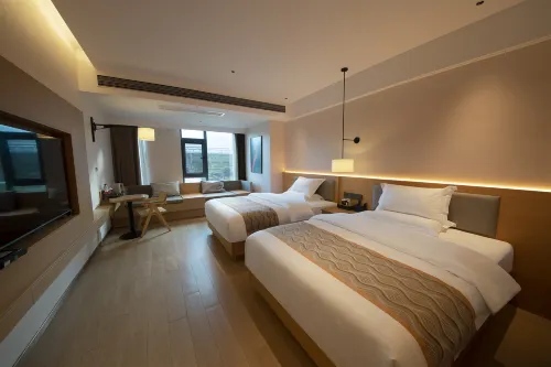 Qiaoxiang Retu Hotel (Yuanjiang Station)