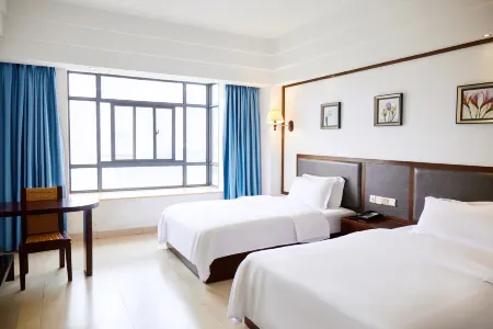 Wenchang Xinhao Business Hotel (Wenchang Park) Отели рядом с достопримечательностью «Dongjiao Coconut Plantations»