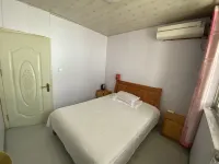 Xinggang Hotel - Homestays