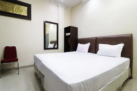 Utama Syariah Отели в г. Simpang Empat