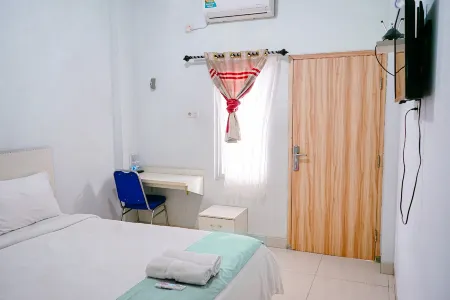 Griya Safitri Syariah Отели в г. Demang Lebar Daun