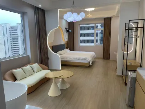 Xinxin Homestay (Yifeng Shidai Square)