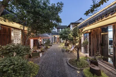 Xitang YiZhao Yixi Huayuan Resort Hotel Отели в г. Цзяшань