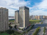 Rezen Dong Hotel (Harbin West Railway Station, Wanda Plaza) Отели рядом с достопримечательностью «Dongqing Stadium»