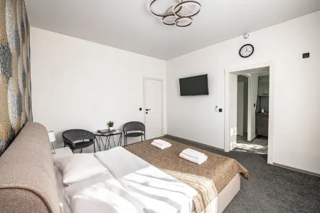 Sunrise апарт-отель (Санрайз) Отели рядом с достопримечательностью «выстрелка о времени»