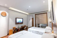 Shiqian Mingshe Art and Culture Hotel (Tangshan Bus Station, Wenquan Avenue) Hôtels à : Shiqian